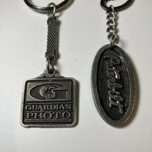 Two Pewter Advertising Key Chains Peterbilt Trucks &‎ Guardian Photo 1.75"-1.25"